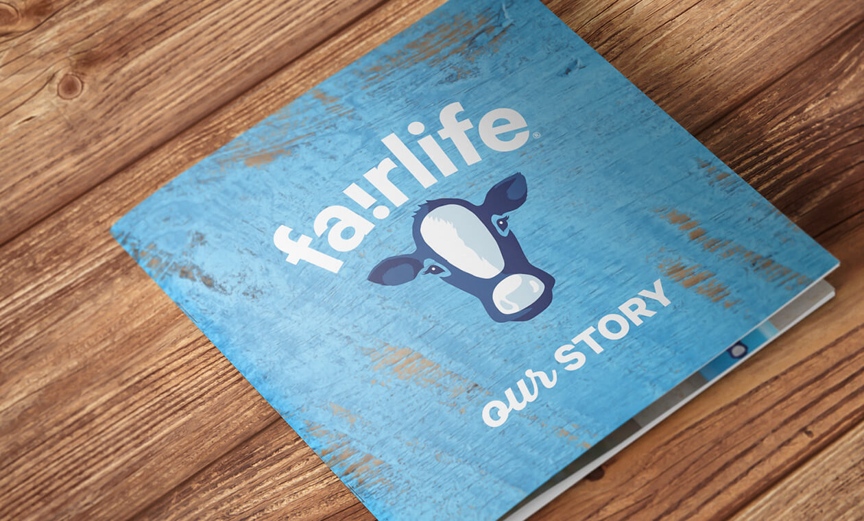 blue cover of a fairlife brochure on wood background